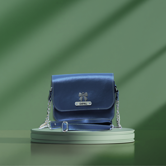 Blue Sling bag with a adjustable chain strap.